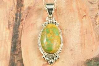 Genuine Crow Springs Turquoise set in Sterling Silver Pendant. Created by Navajo Artist Tsosie White. Signed by the artist. The Crow Springs Mine is located near Tonopah, Nevada. Free 18 inch Sterling Silver Chain with purchase.